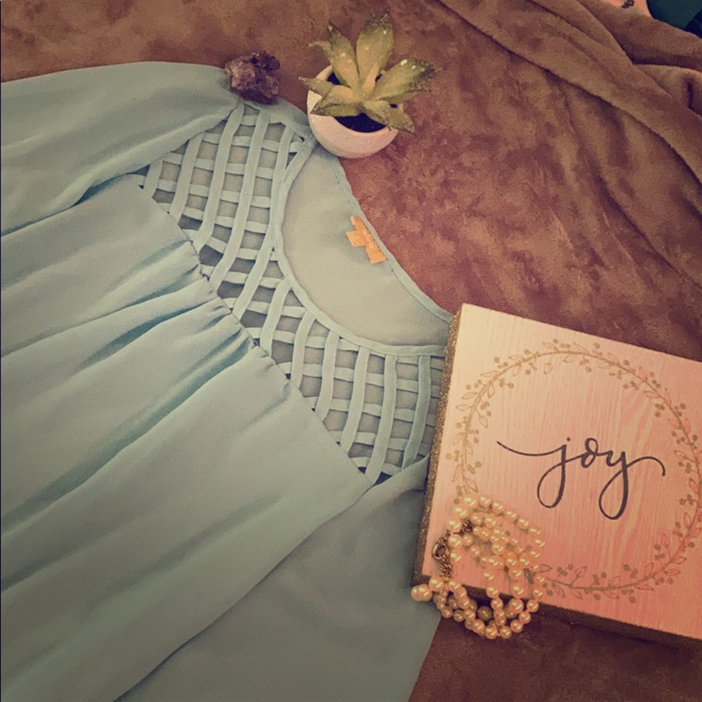 Gorgeous turquoise blouse with lace details